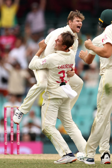 Steve Smith celebrates after taking the wicket of Jack Leach. 