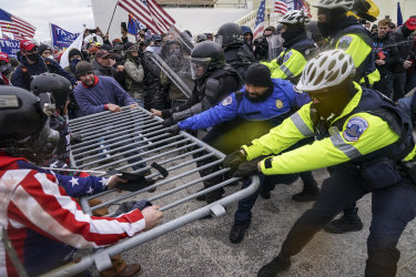 Trump supporters beat down barricades and attacked police in a violent riot that left at least five dead, including two Capitol Police officers.