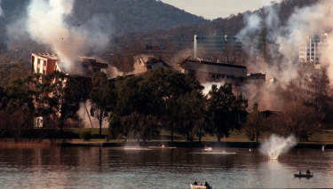 IMPLOSION 970713.. EX CANBERRA TIMES.  OLD CANBERRA HOSPITAL IMPLOSION ON ACTON PENINSULA, LAKE BURLEY GRIFFIN.  DEBRIS LANDS IN THE WATER AS SYLVIA CURLEY HOUSE COLLAPSES. 