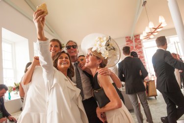 Today Show co-host Lisa Wilkinson stops for a selfie with Foreign Minister Julie Bishop, partner David Panton and his two daughters Sally (right) and Laura (left) in the Emirates marquee. 