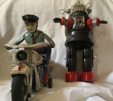 Vintage toys, such as this Robbie the Robot, circa 1950s, and Tim Plate battery operated motorcycle from the 1960s can attract hefty prices. 
