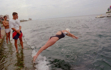 Susie Maroney dives into the water from the Malecon area of Havana on her second attempt to cross without assistance from Cuba to the U.S. on May 11, 1997.