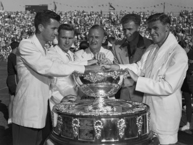 The victorious Australian Davis Cup Team with the trophy. (From left) Mervyn Rose, Ian Ayre, Harry Hopman (manager), Ken McGregor and Frank Sedgman. December 28, 1951.