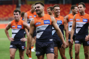 Giants captain Stephen Coniglio leading his team off the field after their AFL round one win over Geelong in March, 2020.