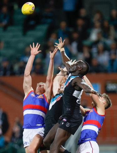 Aaron Naughton and Aliir Aliir fly for a mark.  