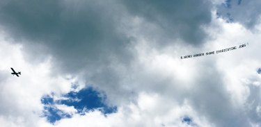 “Labor’s border shame eradicating jobs” reads an aerial banner over the Gold Coast on Friday.
