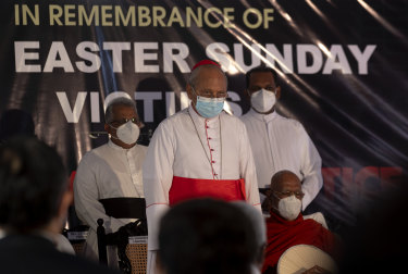 Cardinal Malcolm Ranjith, archbishop of Colombo, center, observes two minute silence for the victims of 2019 Easter Sunday attacks during a service last week.
