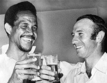 Second innings heroes ... World XI captain Garry Sobers (254) and Australia’s Doug Walters (127) celebrate their impressive numbers.