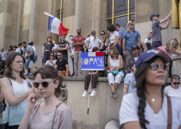 People attend a demonstration in Paris against the COVID-19 pass which grants vaccinated individuals greater ease of access to venues.