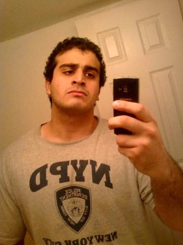 Omar Mateen taking a selfie in an NYPD T-shirt. 