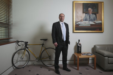 Treasurer Josh Frydenberg, pictured in his Parliament House office, has sent a warning to Australia's financial services regulators. 