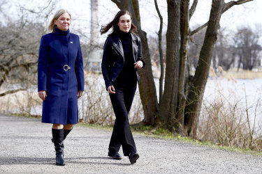 Swedish Prime Minister Magdalena Andersson, left, and Finnish Prime Minister Sanna Marin walk together prior to a meeting on whether to seek NATO membership.