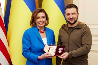 Ukrainian President Volodymyr Zelensky awards the Order of Princess Olga, the third grade, to US Speaker of the House Nancy Pelosi.