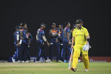 Australia’s Aaron Finch walks off the field after being dismissed by Sri Lanka.