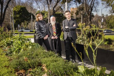 From left, Amy Muir, Russ Vickery and Mark Jacques in East Melbourne’s Family Violence Memorial.