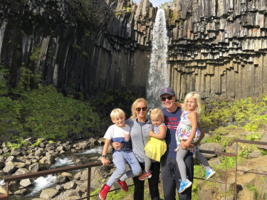 Michael and Brooke Pope with their children Mila, 4, Max, 7 and Daisy Pope, 2 at Svartifoss waterfall, Iceland.