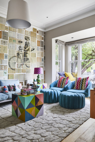 Robynâ€™s sitting room features a mural by Russian artist Ekaterina Panikanova. The chairs are from Early Settler and the table is from Family Love Tree.