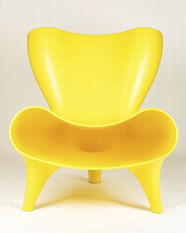 A bright yellow chair by designer Marc Newson.