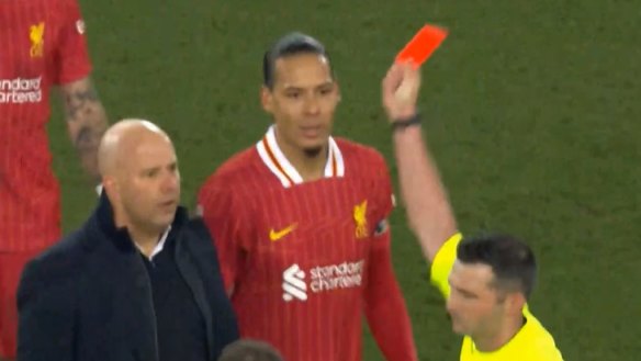 Liverpool manager Arne Slot is shown a straight red in a fiery confrontation with referee Michael Oliver.