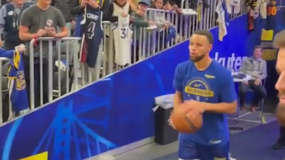 Steph Curry lands a bucket from the tunnel before Golden State's match.