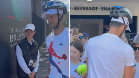 Novak Djokovic wore a bike helmet on his return to the Italian Open after he was hit by a fan's aluminium water bottle while signing autographs a day earlier.