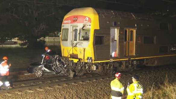 A car has been crushed by a train after it accidentally ended up on the tracks, with the driver escaping just in time.