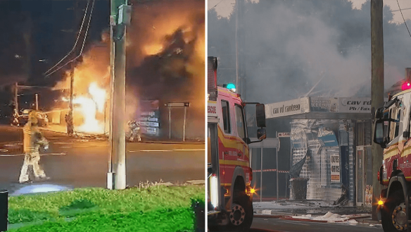 Two people are in hospital after an industrial fire broke out in Coorparoo in Brisbane.