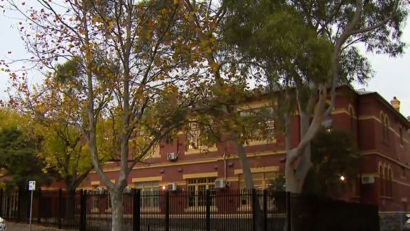 A woman has been charged after allegedly stealing a child from a primary school in Melbourne.