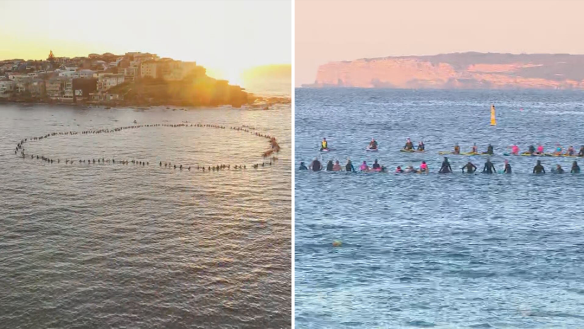 Hundreds of surfers have held a paddle out at Bondi Beach to honour the victims of this month’s stabbing attack at the nearby Westfield.
