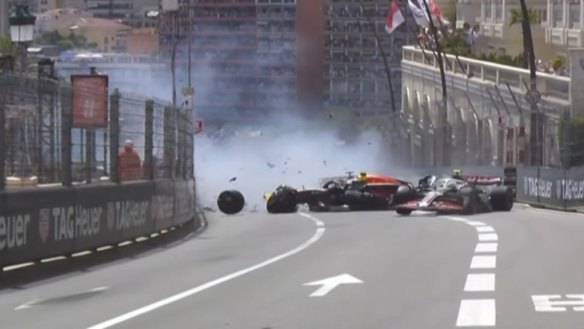 Red Bull's Sergio Perez crashed heavily on lap one of the Monaco Grand Prix after making contact with Haas driver Kevin Magnussen.
