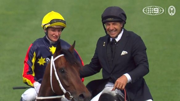 Champion jockey Jamie Kah has stolen the show on the first day of the Melbourne Cup Carnival, riding to victory in the Victoria Derby despite a broken nose.