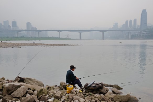 A Chongqing resident fishes on the Yangtze. 