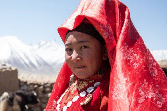Young, unmarried girls wear bright red veils in the Wakhan corridor.