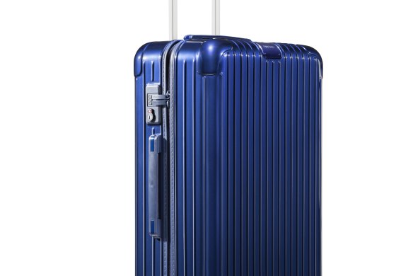 Rimowa "Essential Check-in M" suitcase.