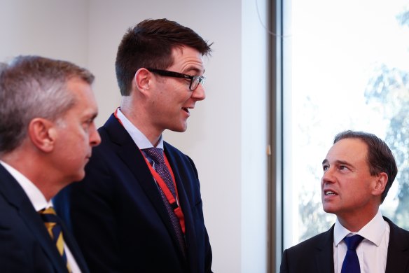 Dr Bastian Seidel (centre), pictured here with Health Minister Greg Hunt (right) in May 2017.