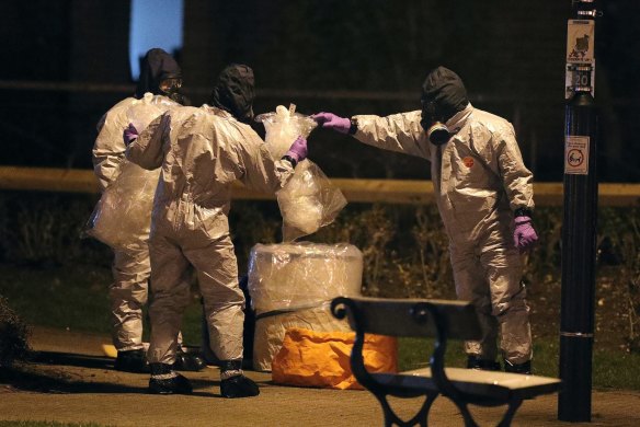 Investigators in protective suits work at the scene of the nerve agent attacks in the Maltings shopping centre in Salisbury, England.