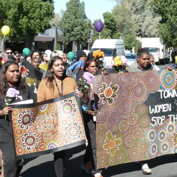 Women in the Tangentyere group march in Alice Springs.