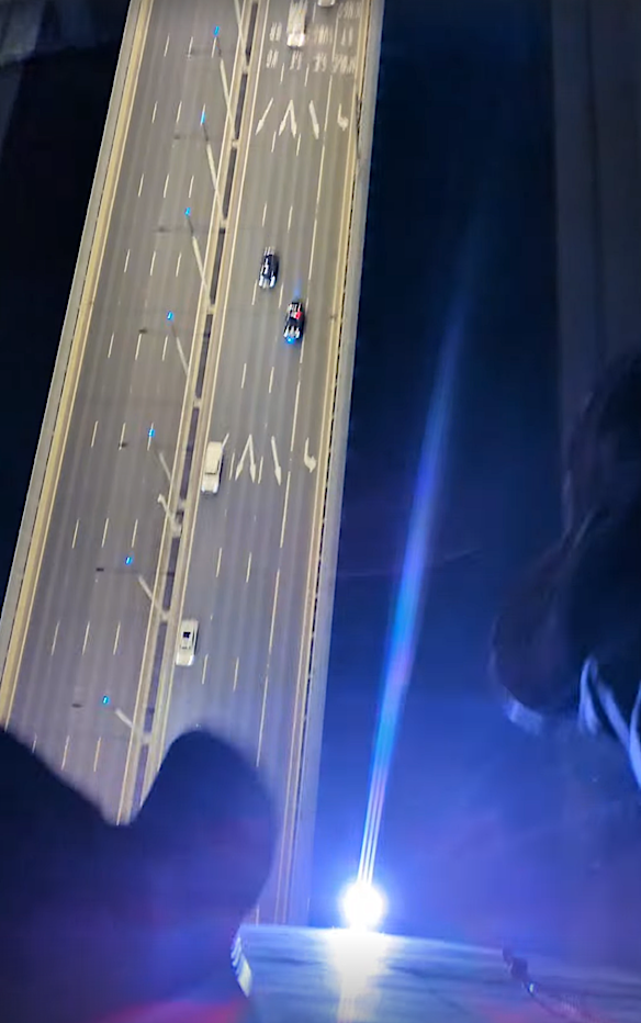 His feet dangling over the edge.