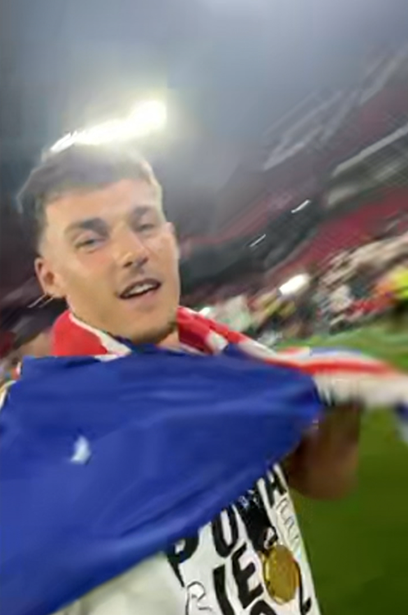 Ajdin Hrustic celebrates his Europa League triumph draped in the Australian flag.