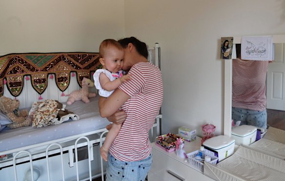 Bethan McElwee with her daughter Aviana McElwee at home on her first birthday.