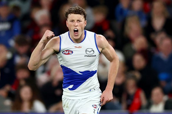 Winning ways: North Melbourne skipper Nick Larkey celebrates on Saturday night.