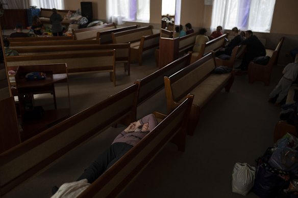 People take shelter inside a church after fleeing from nearby villages that have been attacked by the Russian army, in the town of Bashtanka, Mykolaiv district. The talks between Ukraine and Russia will resume on Friday as NATO Secretary-General says Russia does not appear to be scaling back its military operations in Ukraine but is instead redeploying forces to the eastern Donbas region.