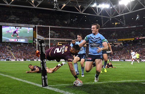 Valentine Holmes of the Maroons scores a second try.