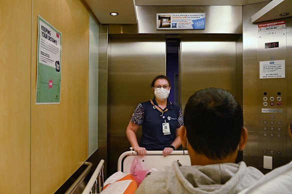 St Vincent's Hospital Wards Person Supervisor Eliza Attwood transfers patient Jeremy Recasa to the cardio thoracic ward at St Vincent's Hospital in Darlinghurst, Sydney. Eliza is receiving her Pfizer COVID-19 vaccine at RPA's vaccination hub today as one of the frontline health workers.