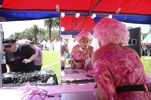 Drag Queen Les Beau Fierce touches up her make-up at the Gay & Lesbian Mardi Gras Fair Day at Victoria Park, Sydney.