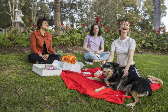 Picnic time in the Botanic Garden for Masha, Raechyl, Leah (from left to right), with Buster the dog. More such freedoms could be in the offing.