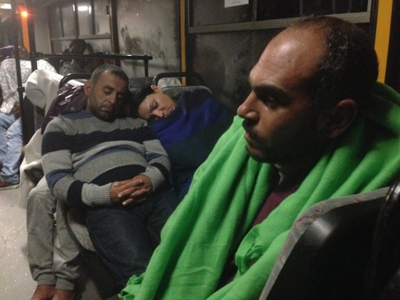 Migrants board buses said to be bound for Austria outside Keleti station in central Budapest, Hungary.