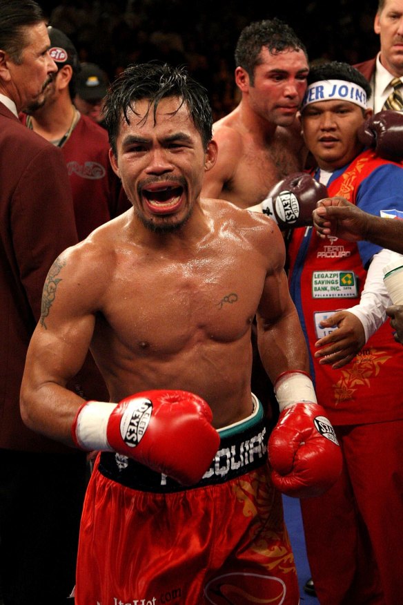 I got your back: Buboy Fernandez congratulates the beaten Oscar de la Hoya after Manny Pacquiao's win in 2008.