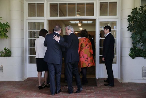 Prime Minister Kevin Rudd embraces Deputy Prime Minister Anthony Albanese after photos are taken at Government House in Canberra on Thursday 27 June 2013.
