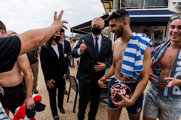 Formidable campaigner: Morrison meets the locals after a visit to the Terrigal Surf Life Saving Club.